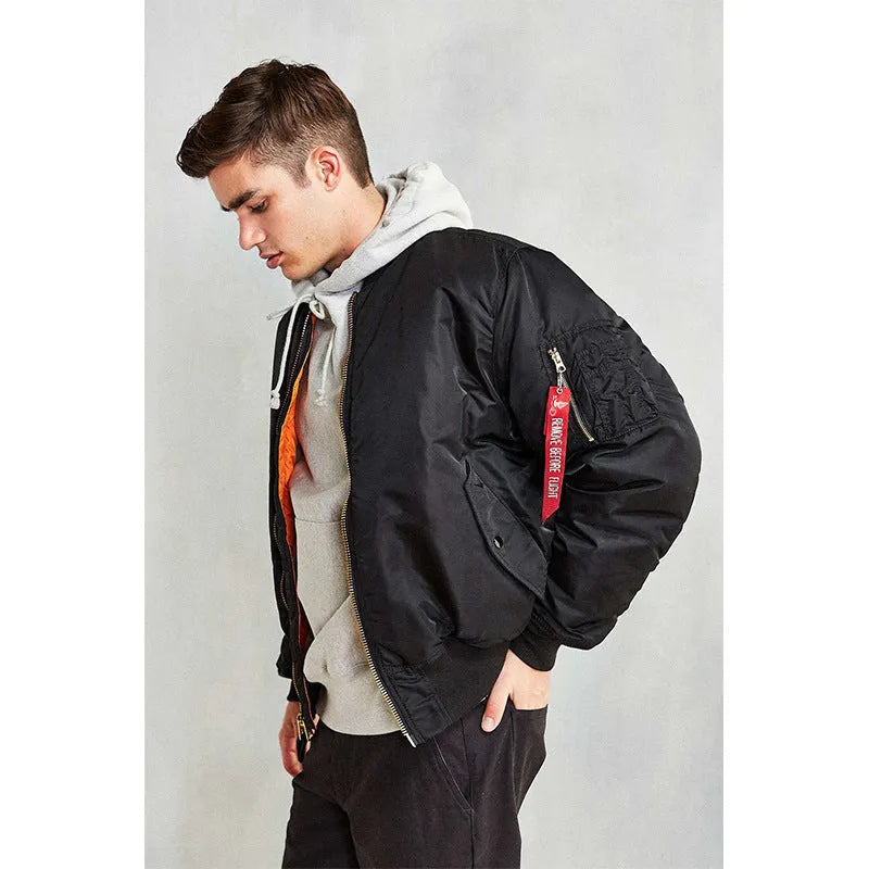Men's loose fit army green nylon pilot jacket with cotton padding on a mannequin.