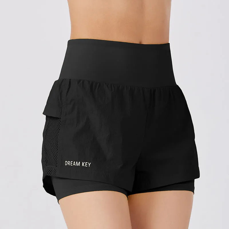 Women's loose fit cotton blend fitness shorts in lemon yellow colour on a hanger