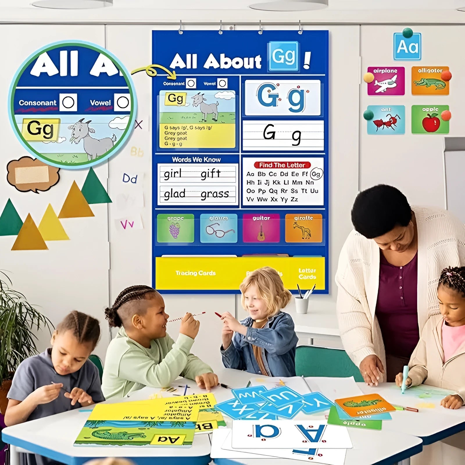 Alphabet learning chart with word cards, letter cards, and picture cards laid out for educational play.
