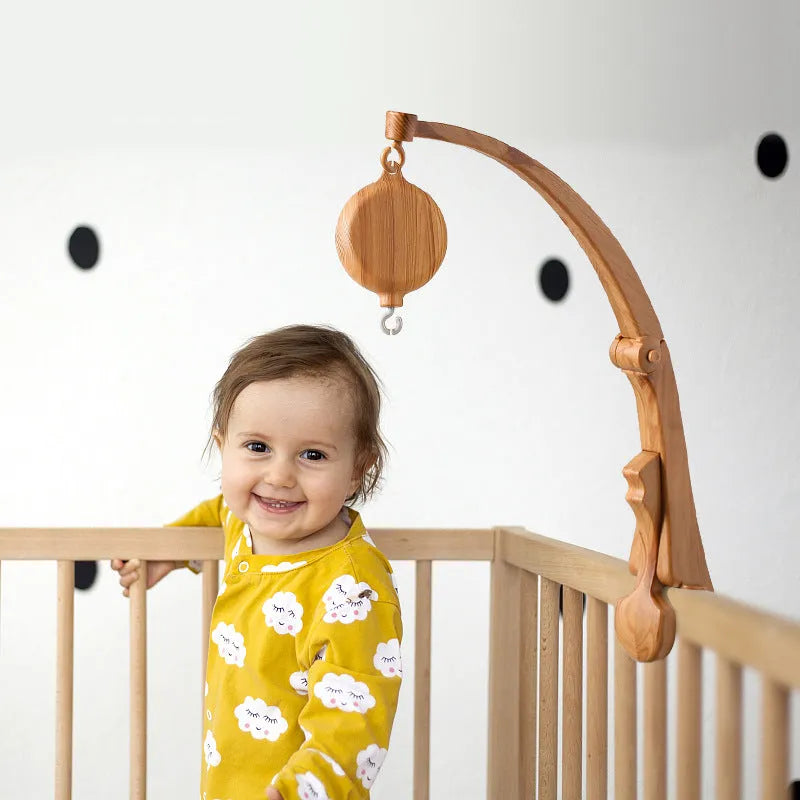 Newborn wood grain bracket music box bed bell in brown, foldable plastic, for infant cot use