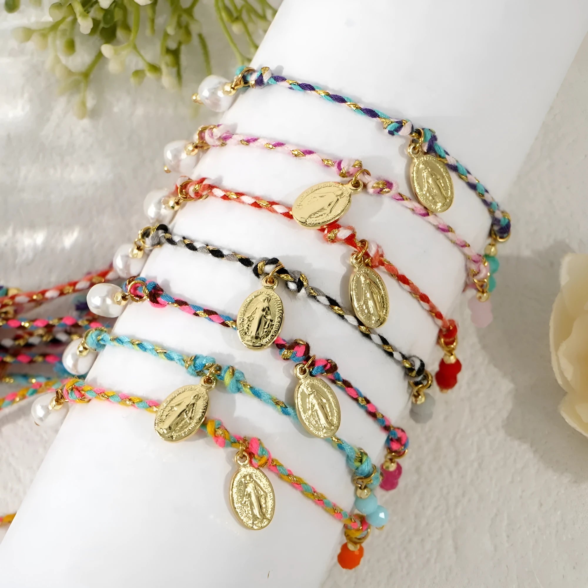 Hand-woven women's bracelet made from colourful braided rope with an integrated carrying strap tag design.