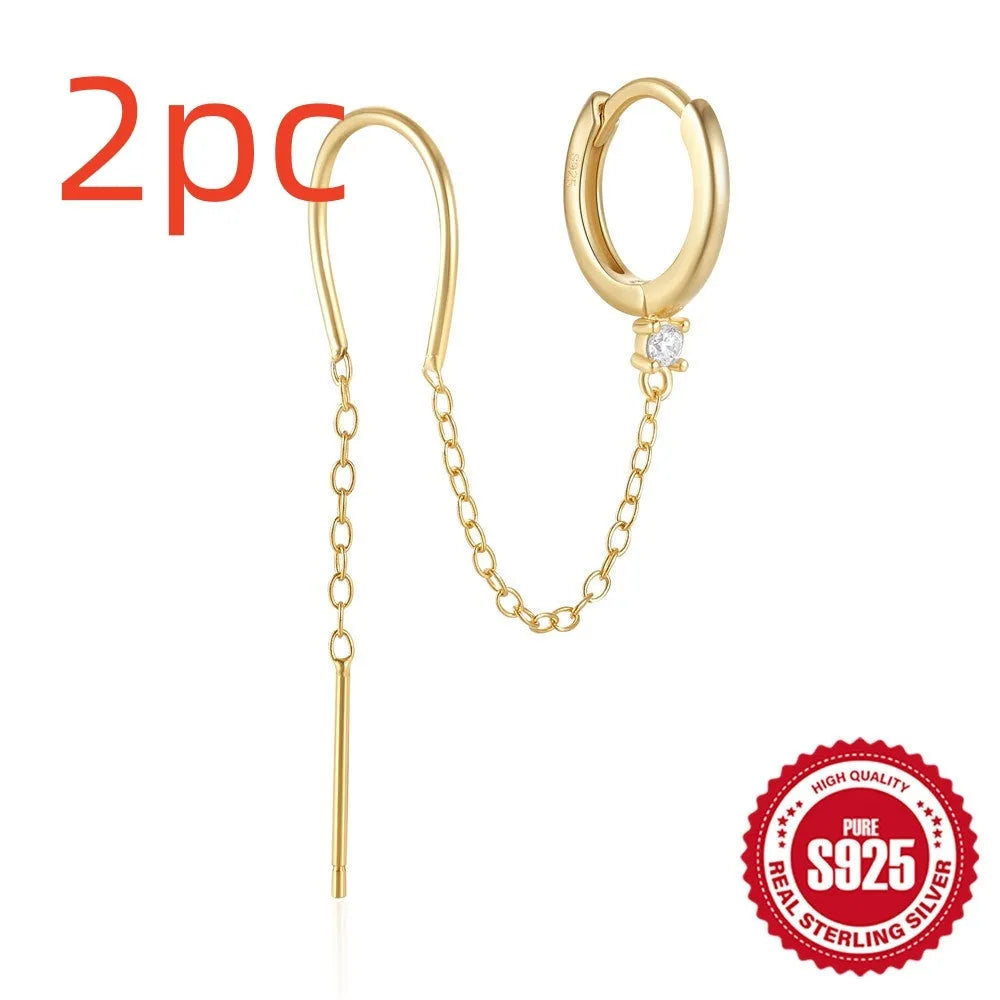 S925 sterling silver stud earrings with a floral motif and dangling gold-coloured tassel chain.