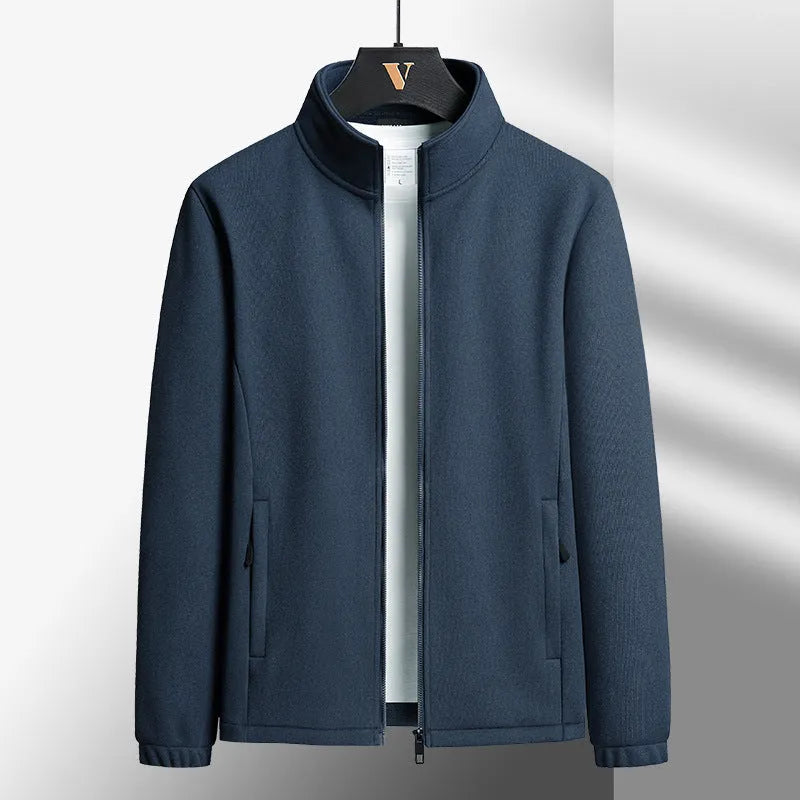 Man wearing a thick grey Berber fleece coat cardigan with a stand-up collar and zippered front.