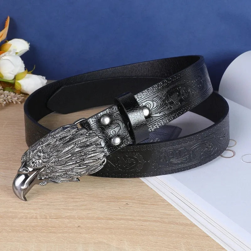 Cow head buckle men's imitation leather belt in black and brown colour options showing decorative alloy buckle detail