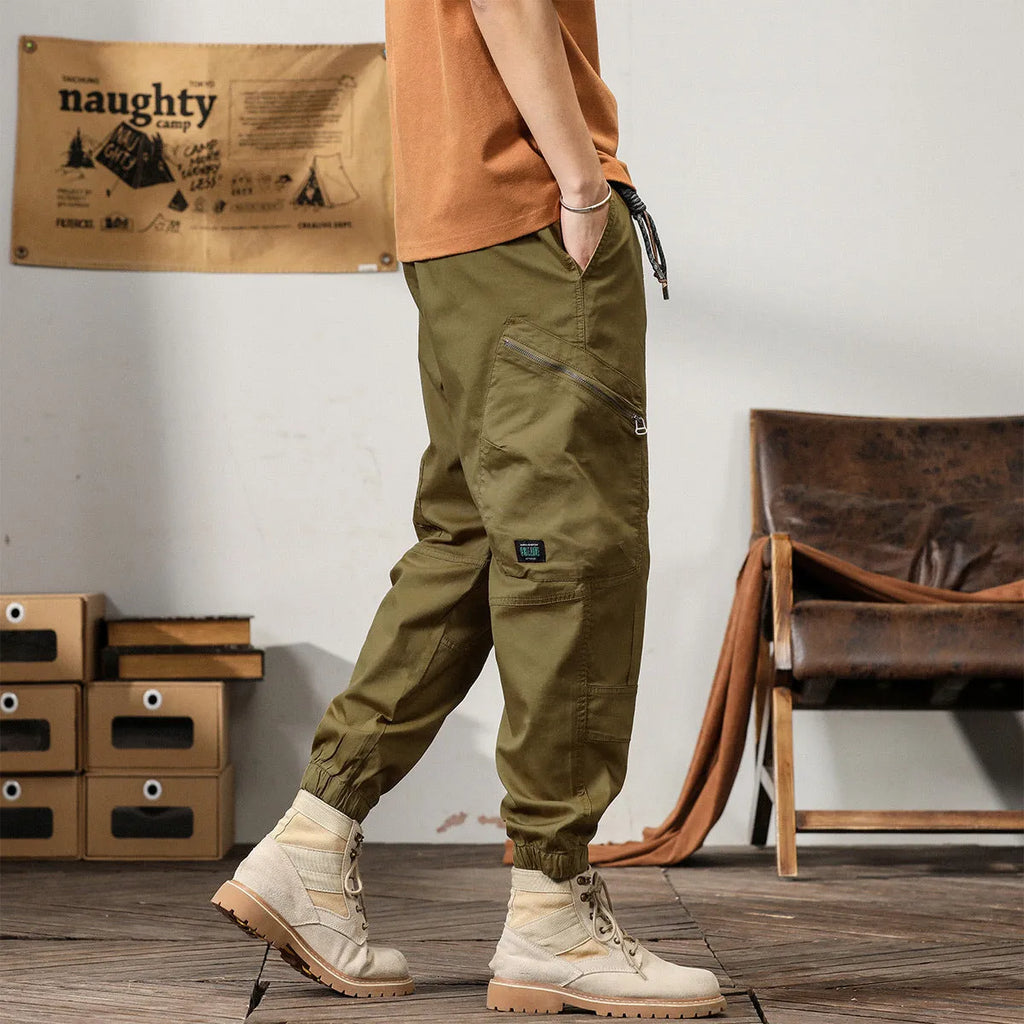 Men's Korean style tapered harem pants in cotton with small leg opening and mid-waist design