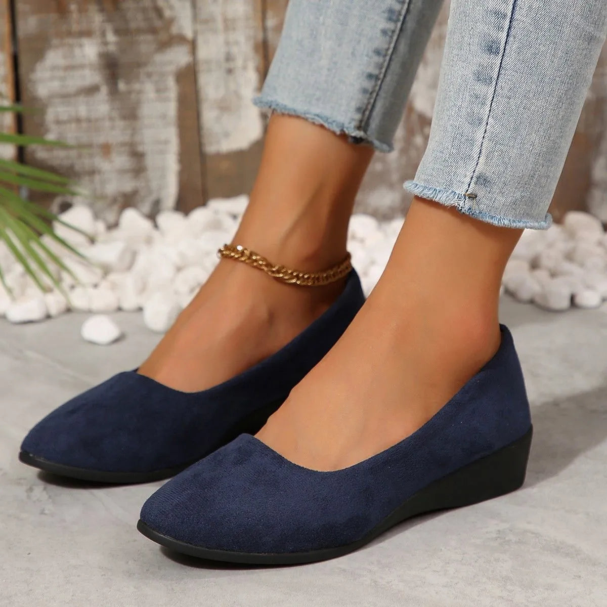 Women's pointed toe wedge pumps in suede with low wedge heel