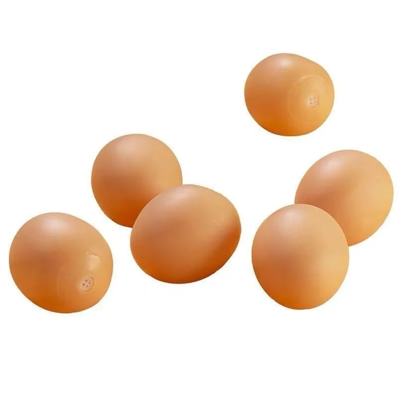 Chicken-flavoured simulation egg dog toy with textured surface for dental cleaning