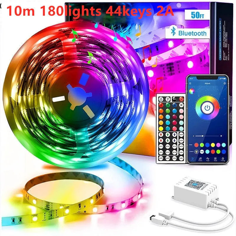 Roll of flexible RGB LED strip light with Bluetooth controller and power adapter on a table