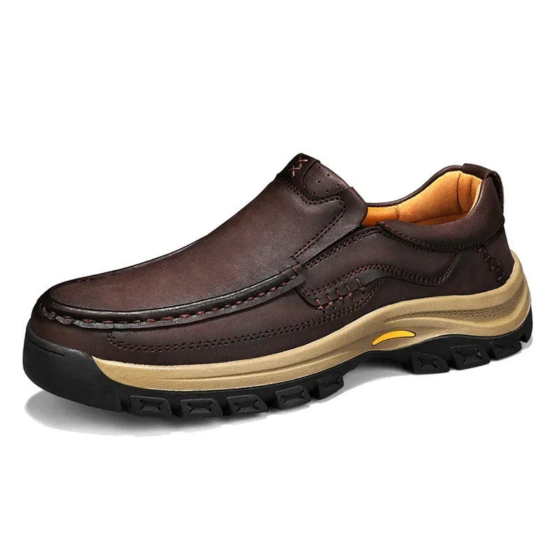 Men's black thick-soled mountaineering boots with round toe and rubber sole.