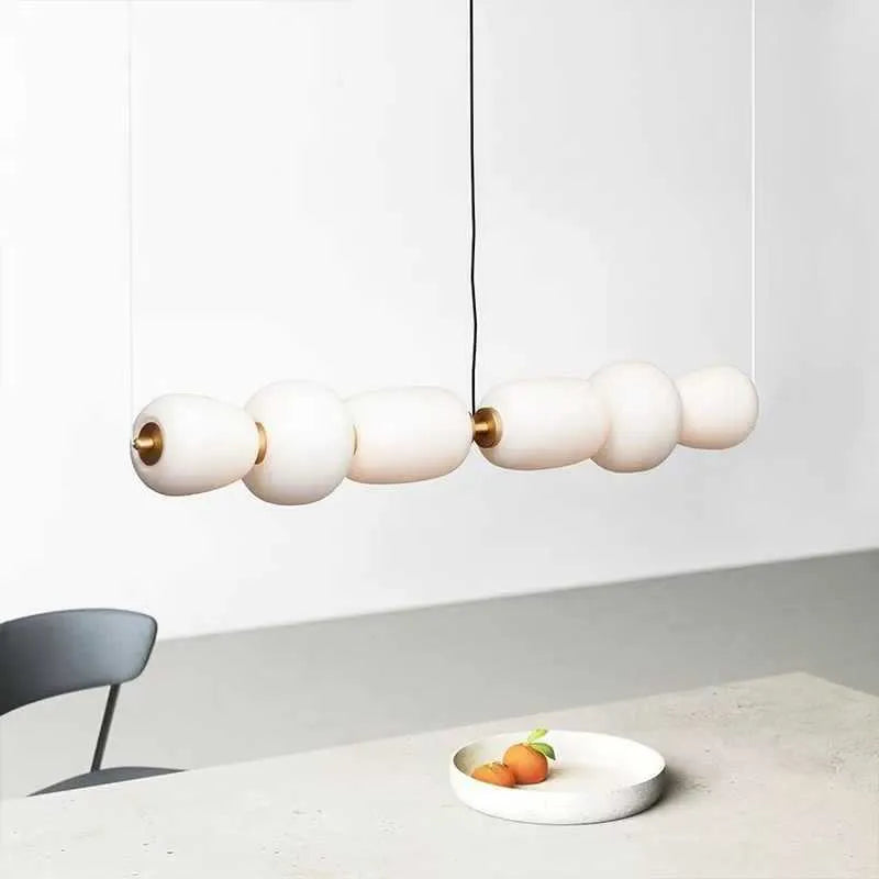 Modern minimalist long chandelier with iron frame and glass accents, warm LED light, Type C style