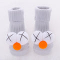 Cotton baby floor socks in various colours and patterns with size guide for ages 0-3 months