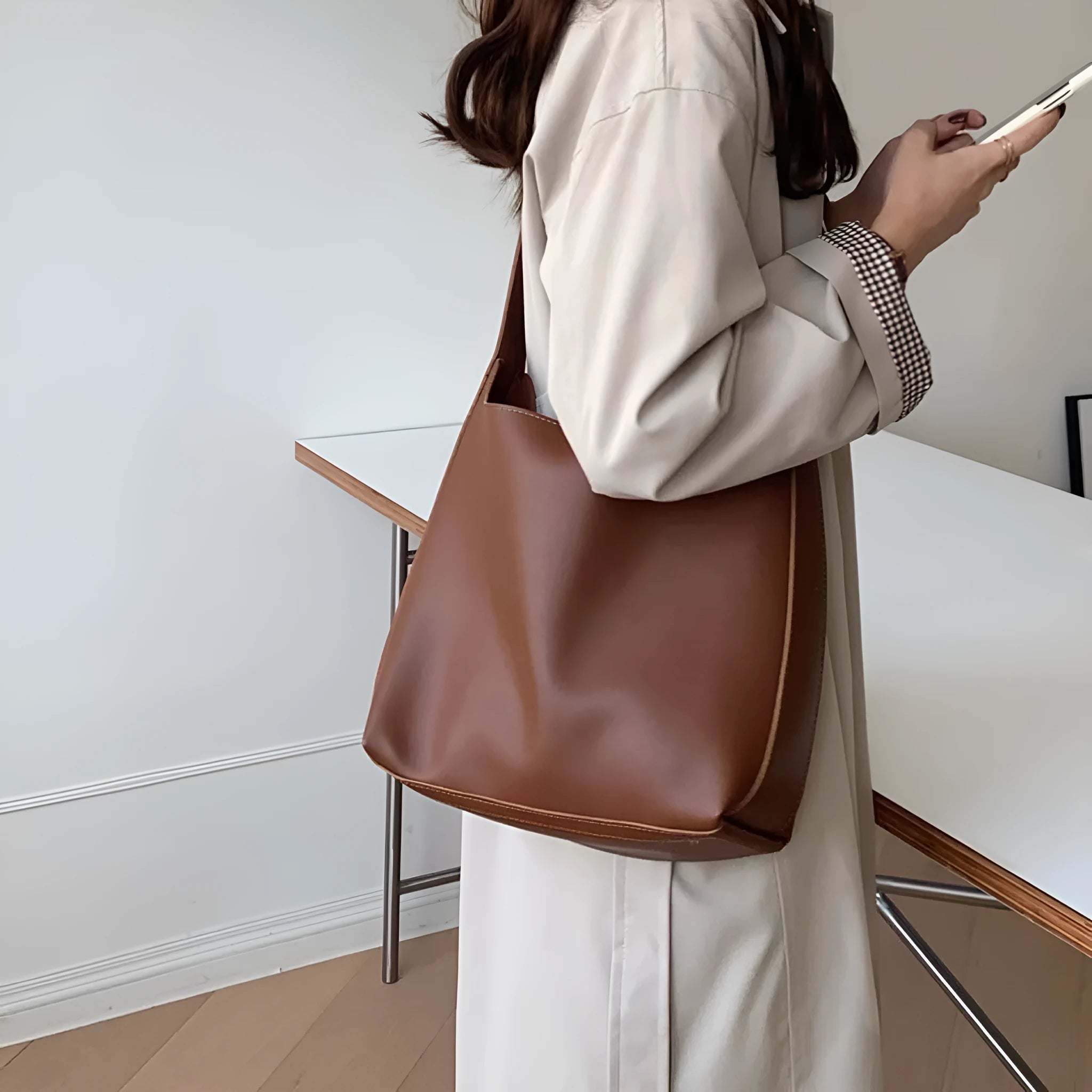 Women's soft PU shoulder bag with swing threads in black or brown colour options