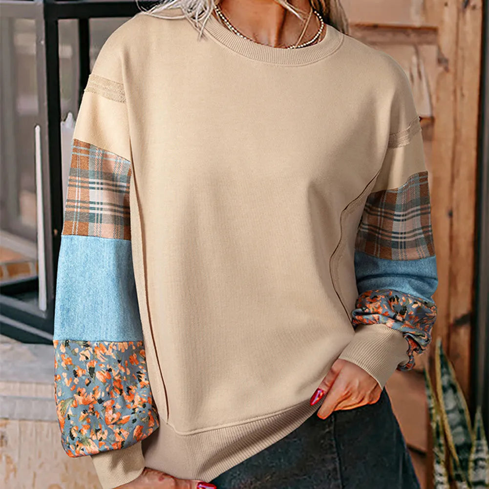 Women's loose plaid long-sleeved casual top in apricot colour on a hanger.