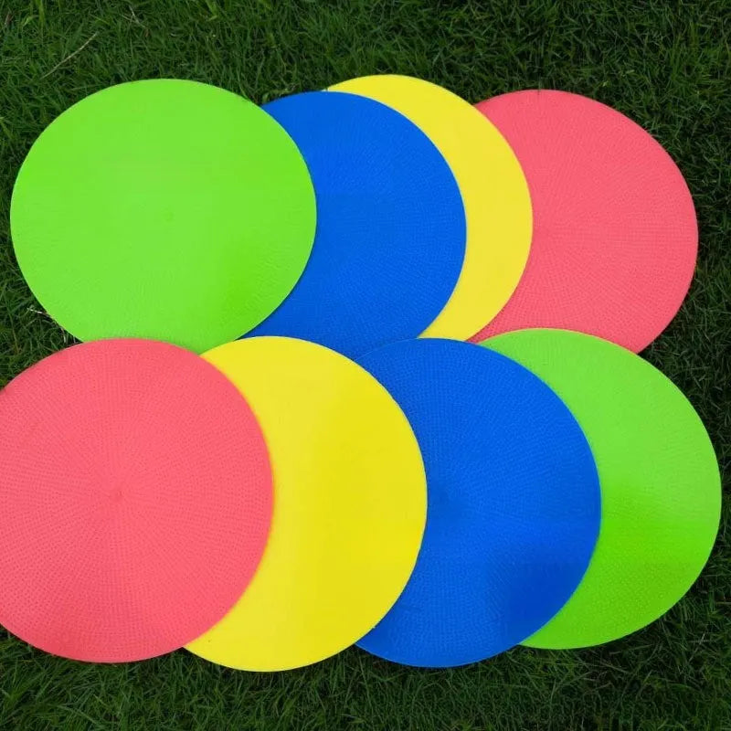Soft yellow football landmark pad disc on grass, 23cm diameter, for training targets.