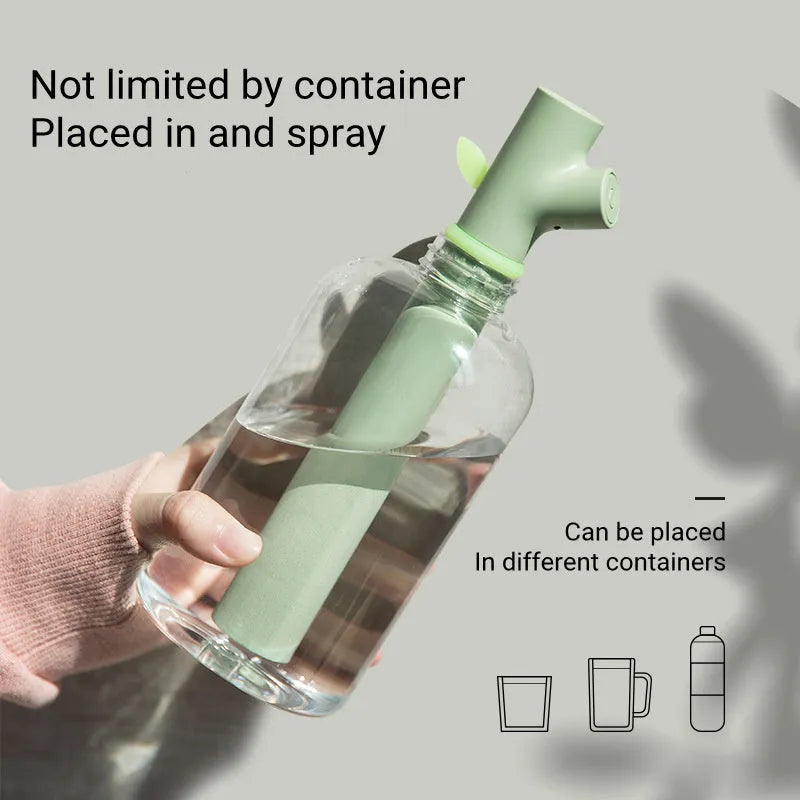 Transparent plastic USB humidifier with branch design and water visible inside