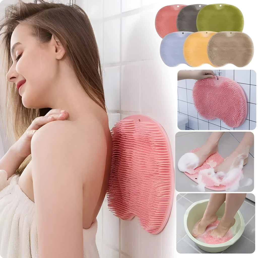 Orange TPR bath brush with silicone bristles and suction cups on base, shown on bathroom tiles.