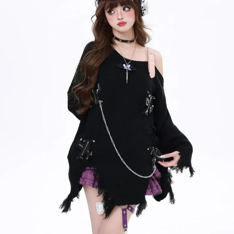 Women's off-the-shoulder loose fit sweater with ripped detailing and tassel trim in black, on model