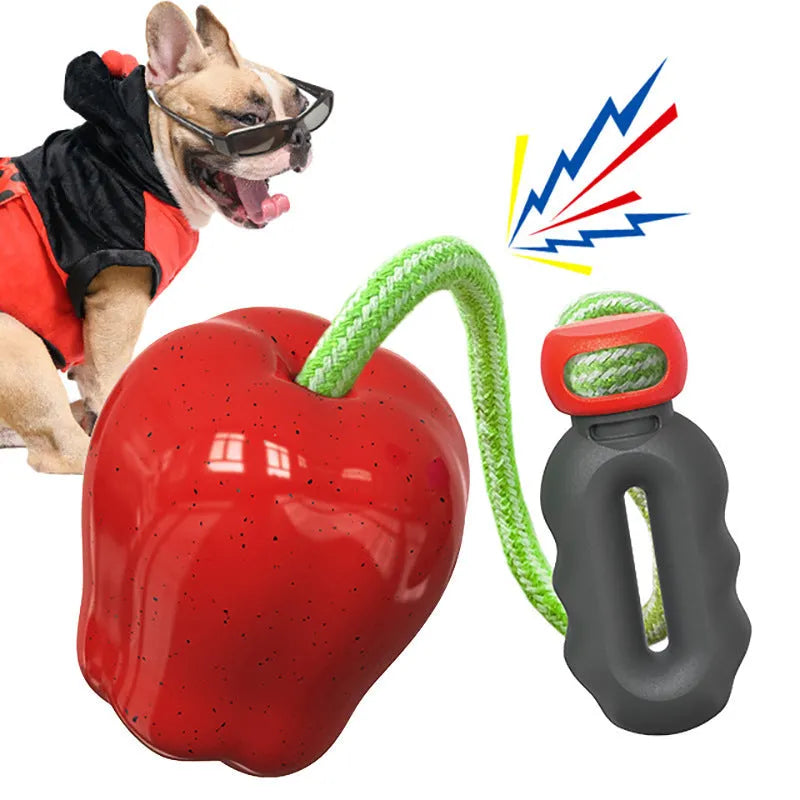 Plastic apple-shaped dog chew toy with molar texture and hollow centre for food dispensing.