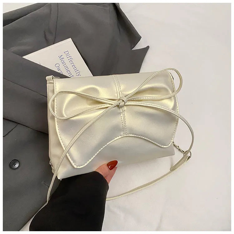 Women's underarm crossbody bag in horizontal square shape with sandwich pocket design and crossbody strap