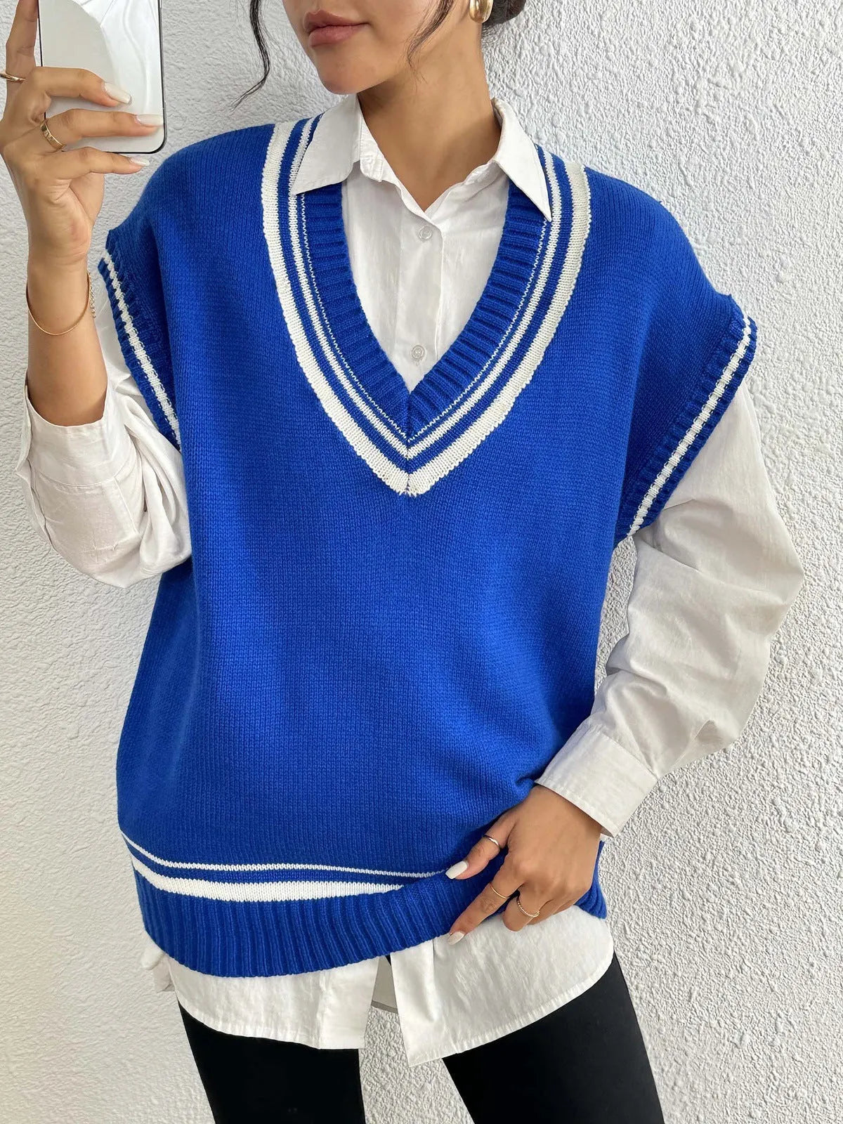 Women's loose-fit college-style pullover vest jumper in black, blue, or coffee colour.