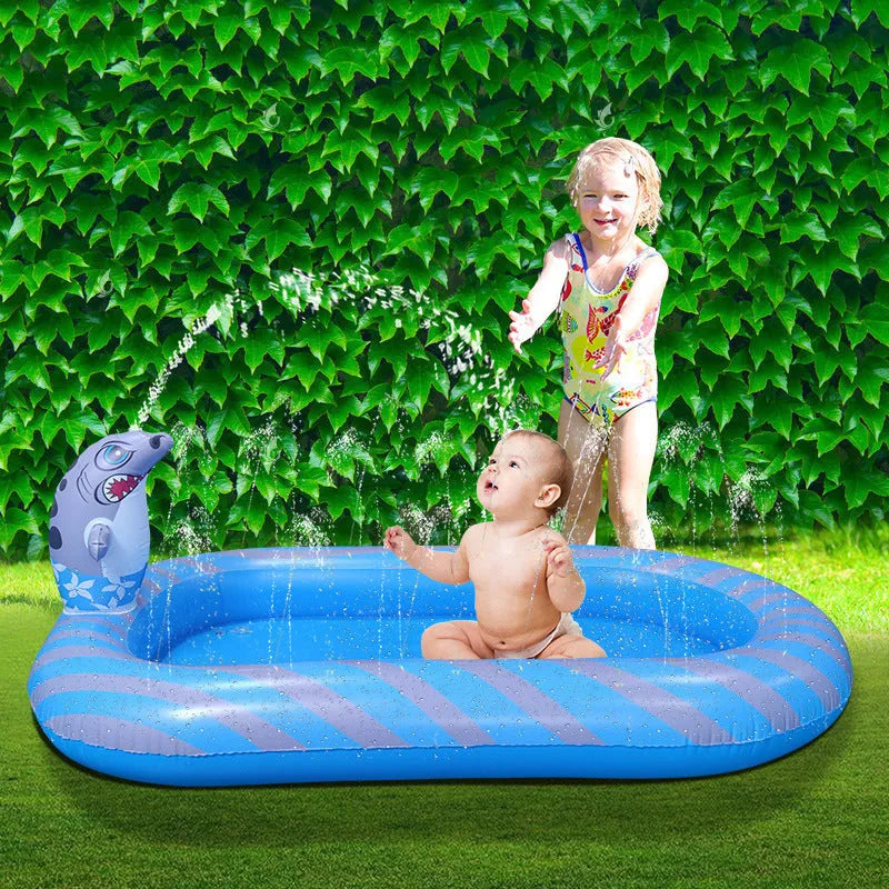 Blue inflatable dinosaur and shark themed children's play pool in a garden setting.