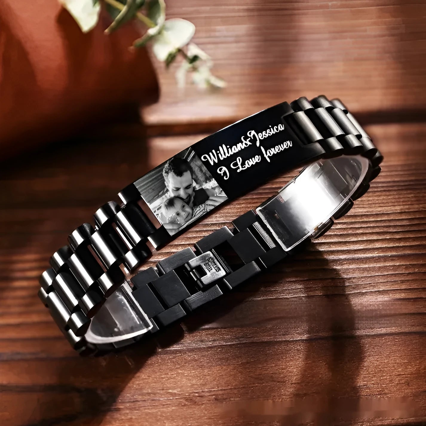 Titanium steel bracelet with curved heart-shaped piece featuring black lettering design