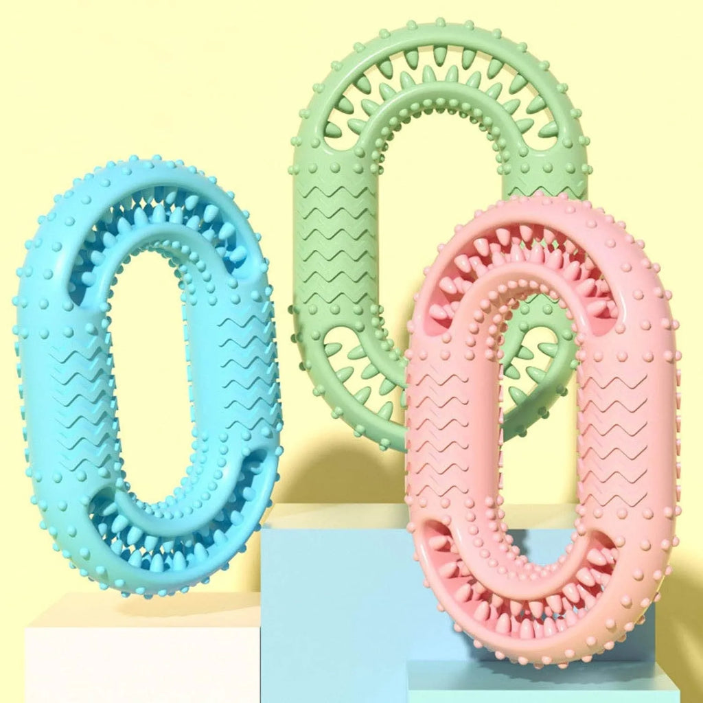 Blue O-ring shaped dog chew toy for aggressive chewers and dental health on a plain background.