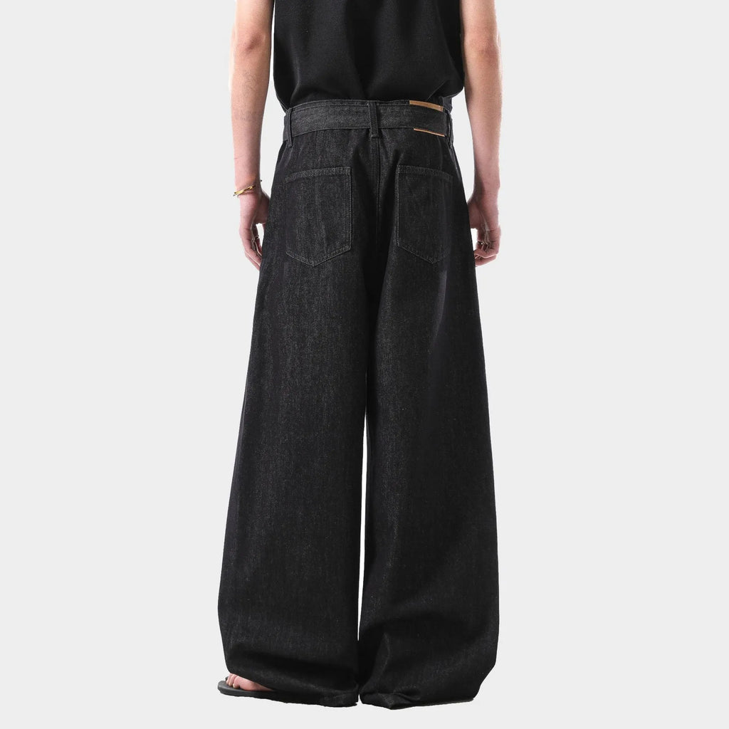 Black high waist straight leg women's jeans with gold detailing on a mannequin.