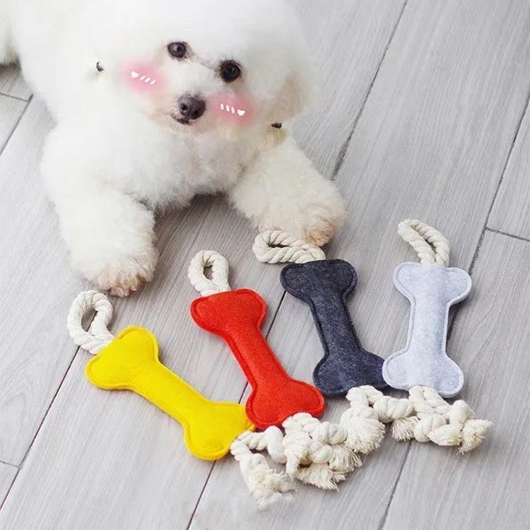 Bone-shaped dog chew toy with felt exterior showing rope knot texture inside, 16cm long in blue colour