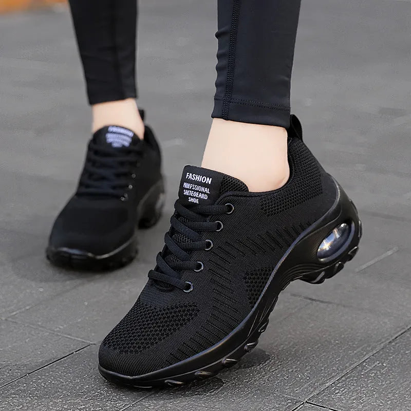 Women's red and black low top mesh sneakers with round toe and front lace-up design showing 3-5cm heel