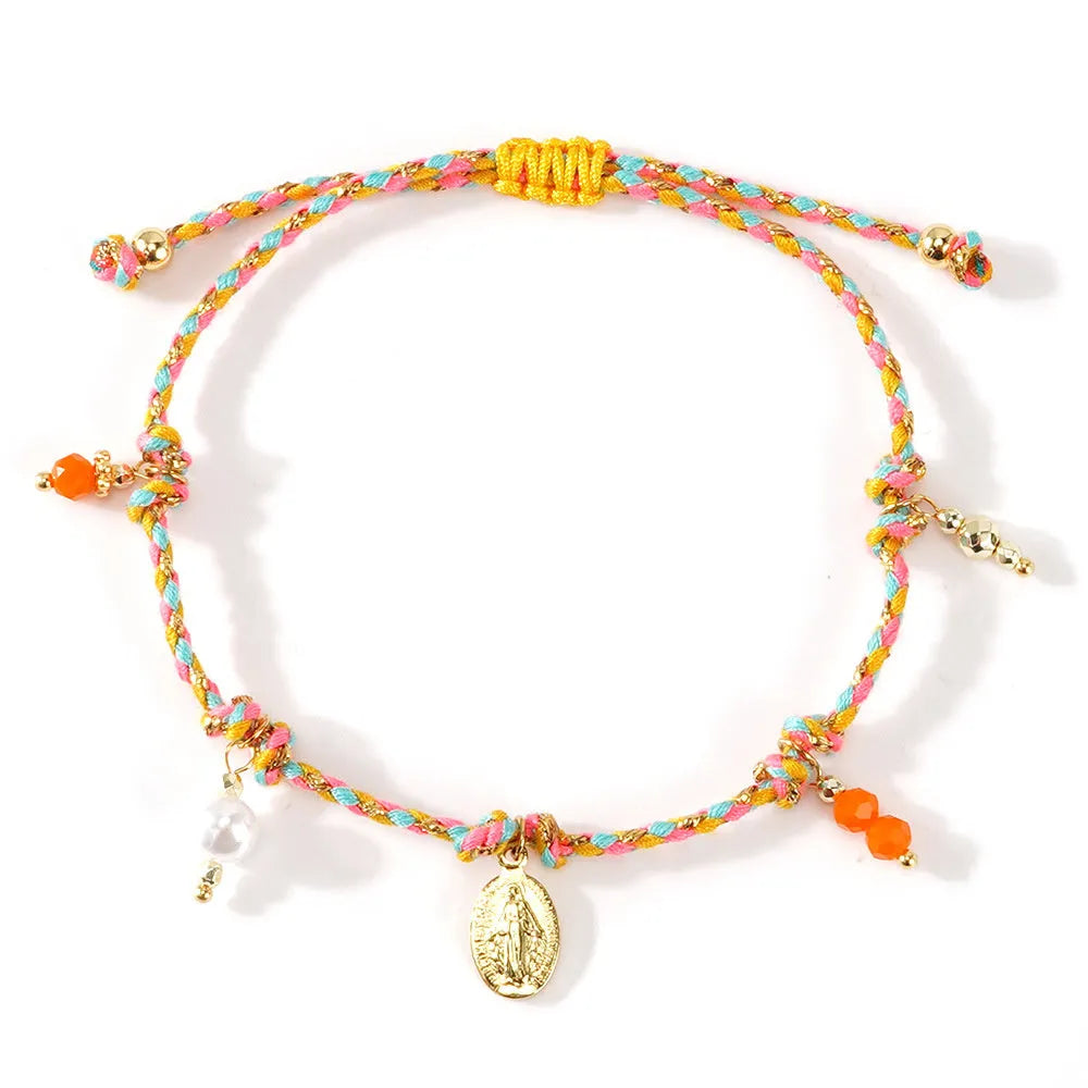 Hand-woven women's bracelet made from colourful braided rope with an integrated carrying strap tag design.