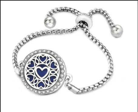 Hollow stainless steel adjustable aromatherapy bracelet with 20mm box diameter and electroplated alloy finish on white background