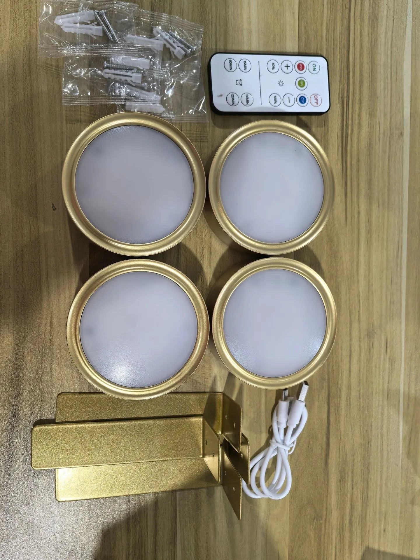 Wireless LED painting lamp with a magnetic mounting belt and remote control in black finish.