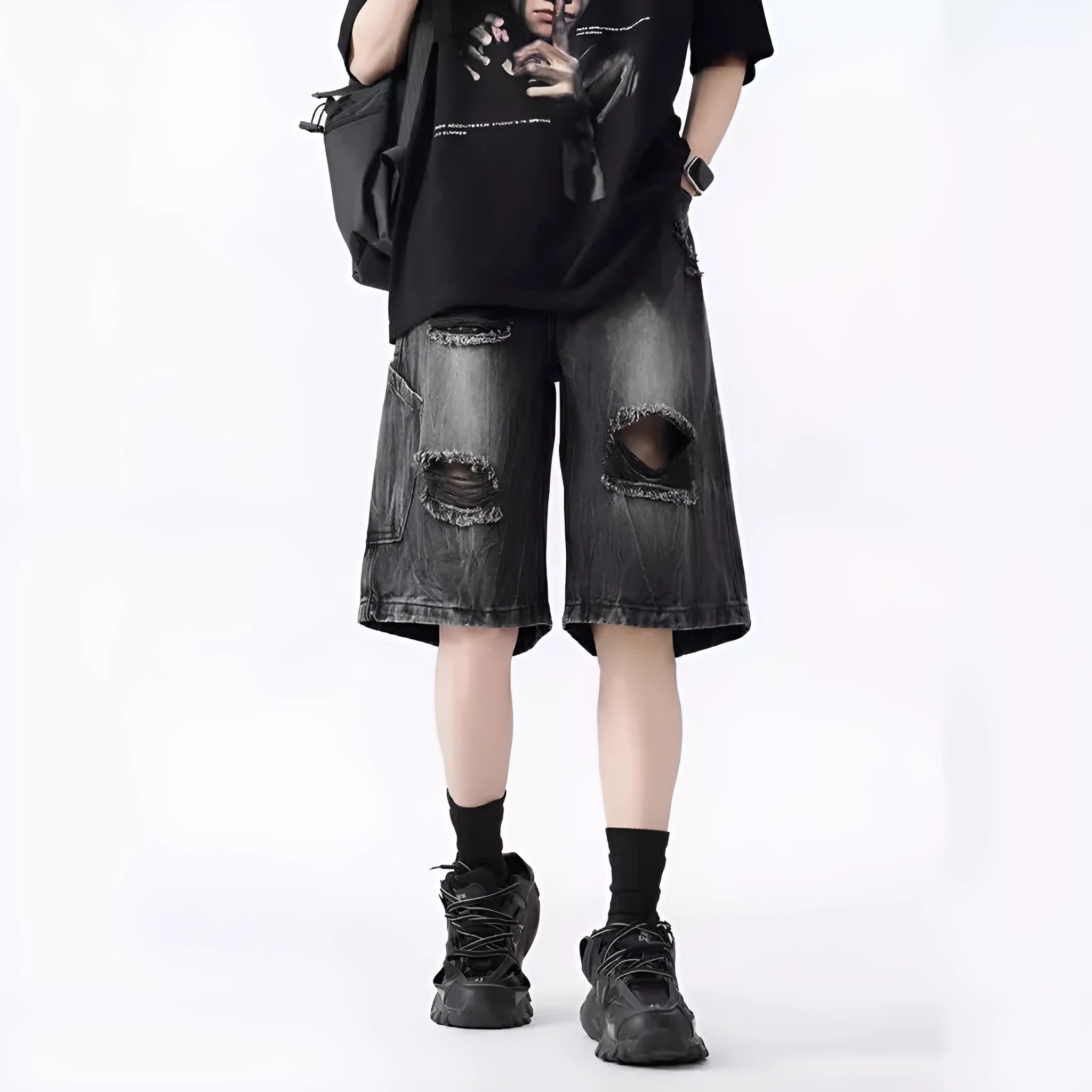 Women's washed denim shorts with ripped detailing in loose retro fit, shown in black and blue colour options