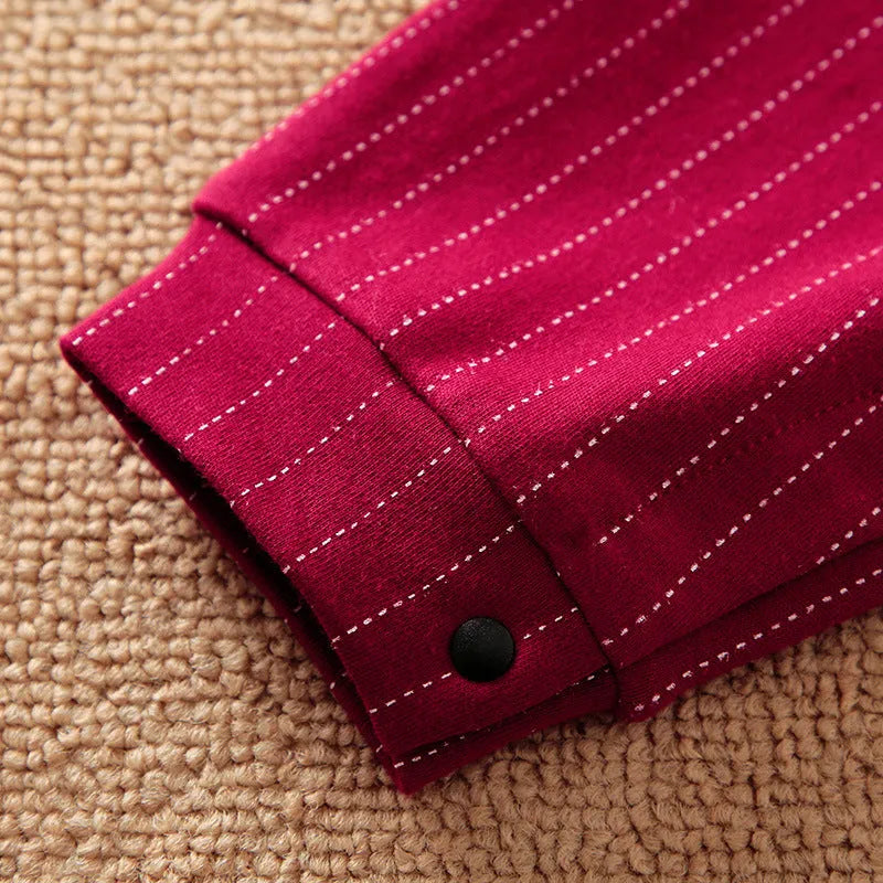 Wine red long sleeve cotton romper for a baby boy with a single-breasted closure.