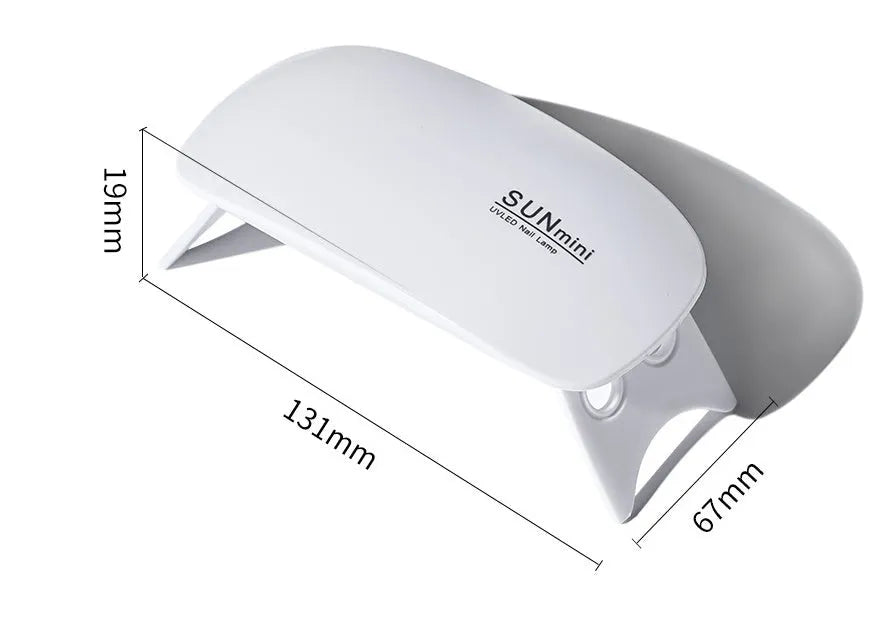 Mini Mouse pink LED phototherapy machine for nail gel curing with 6 lamp beads on a white surface