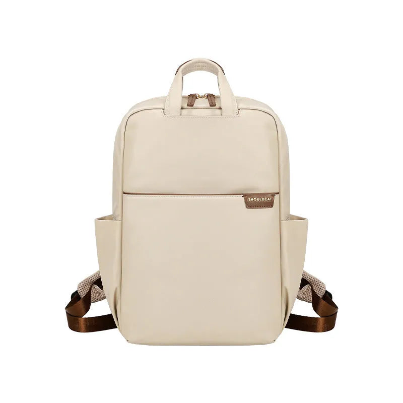 Women's canvas travel backpack showing organisational compartments and breathable design in apricot colour