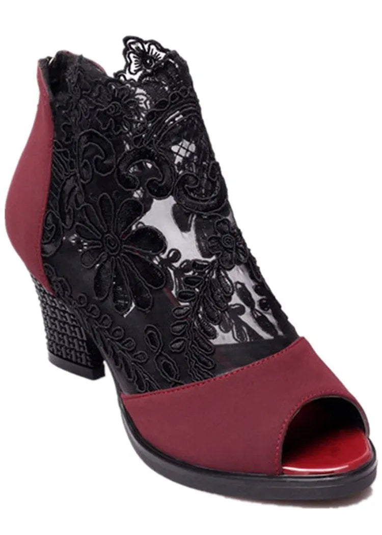 Women's black lace gladiator sandals with square high heel and zip closure, showing flower pattern detail