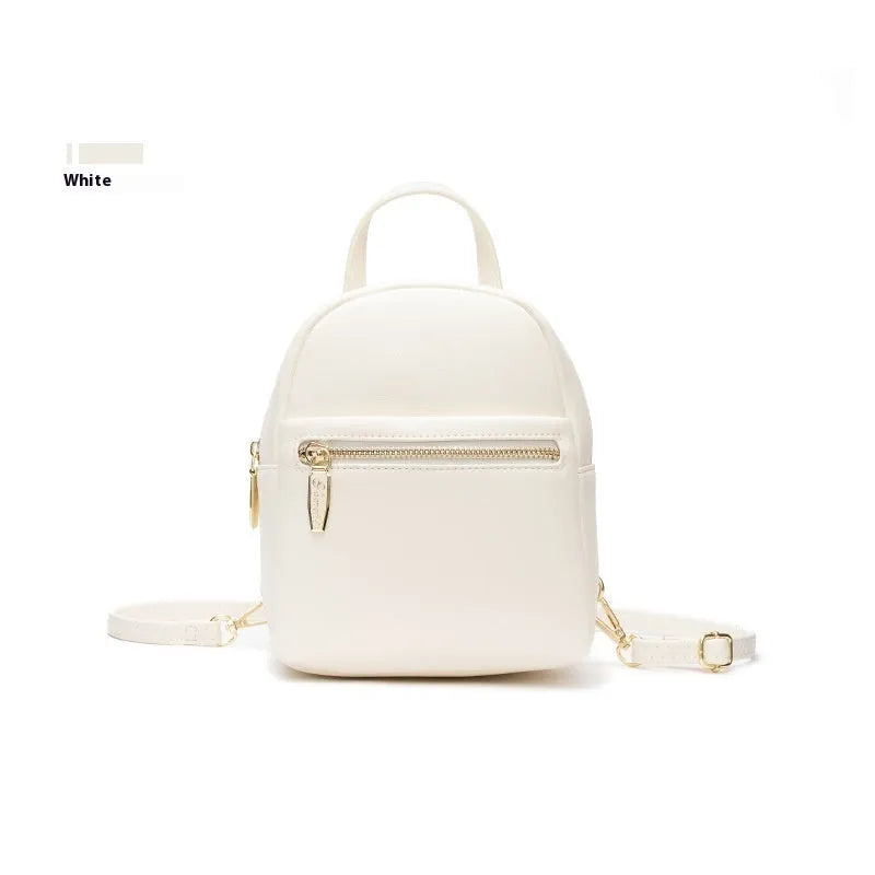 Soft PU mini backpack in street trend style with three-dimensional outer pocket, shown in one of six colour options.