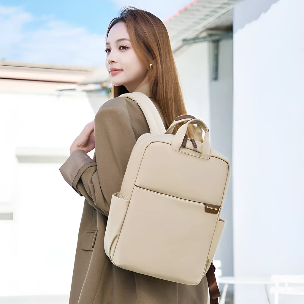 Women's canvas travel backpack showing organisational compartments and breathable design in apricot colour