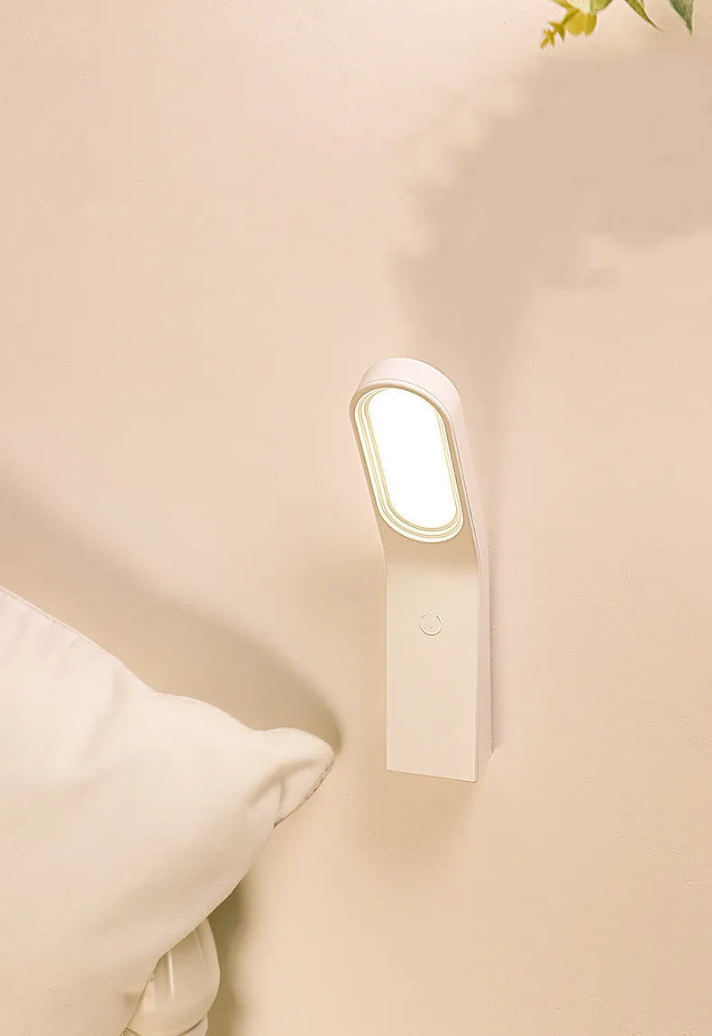 Simple white LED desk lamp with touch control and USB cable on a modern desk