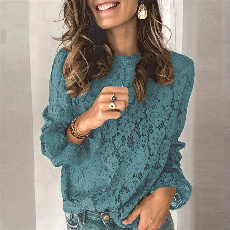 Women's green loose-fit lace shirt with hollow-out detailing and a zip, long sleeves, and a round neck.