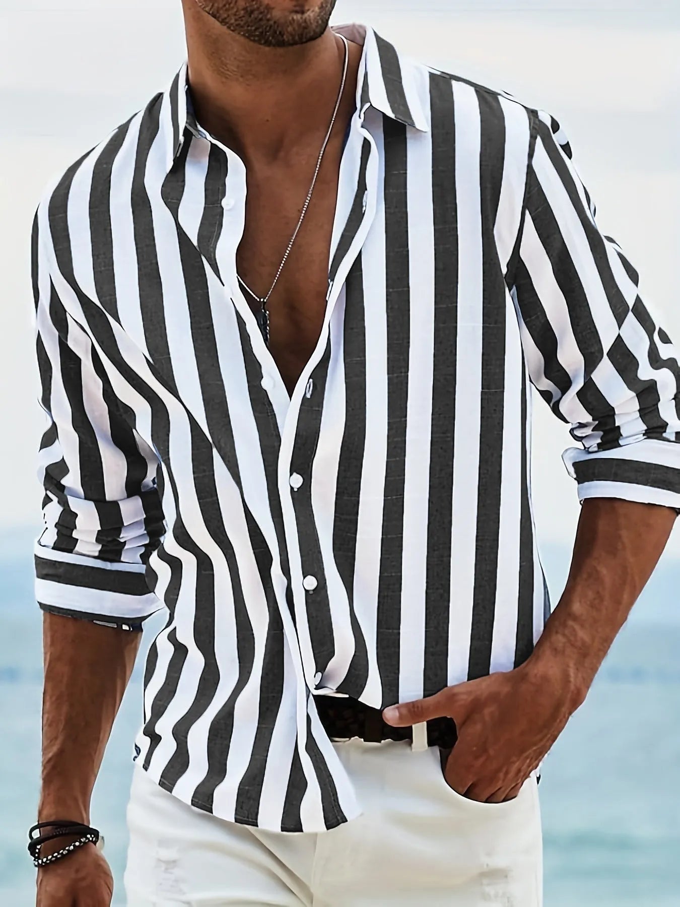 Men's loose-fit striped long-sleeved casual shirt in a light grey colour, showing cardigan style.
