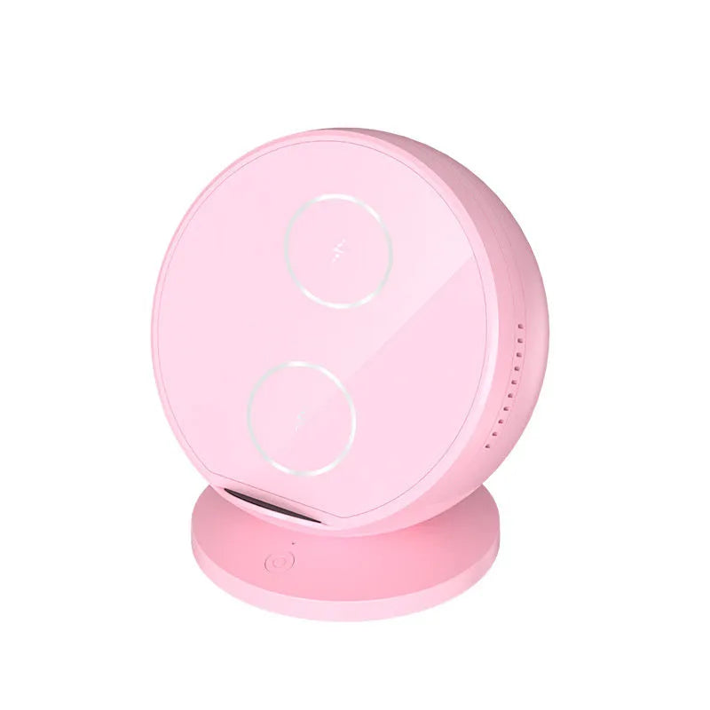 Black multifunctional mobile phone wireless charger holder with Bluetooth speaker, showing phone in cradle.