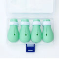 Four green silicone cat paw scratch protection covers with elastic straps