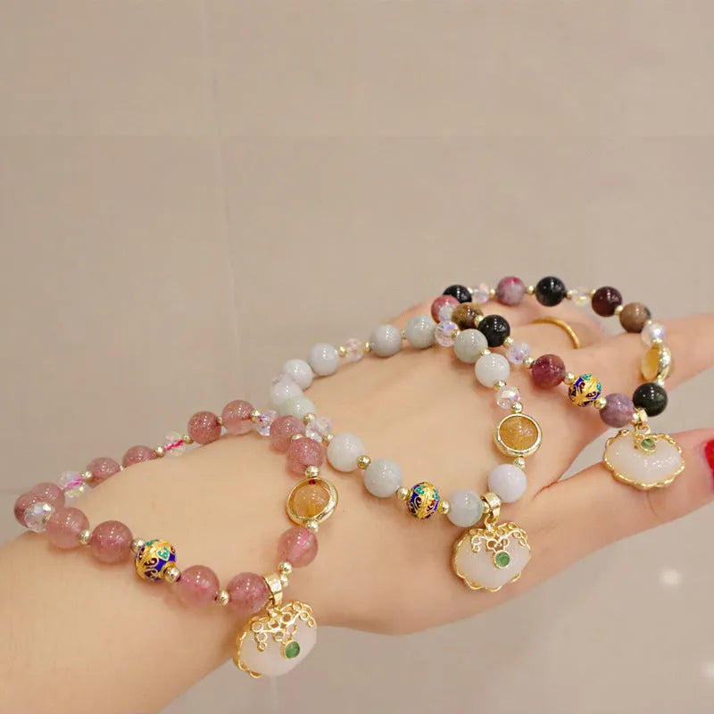 Women's bracelet with strawberry quartz and gray jade stones and ethnic metal decorations