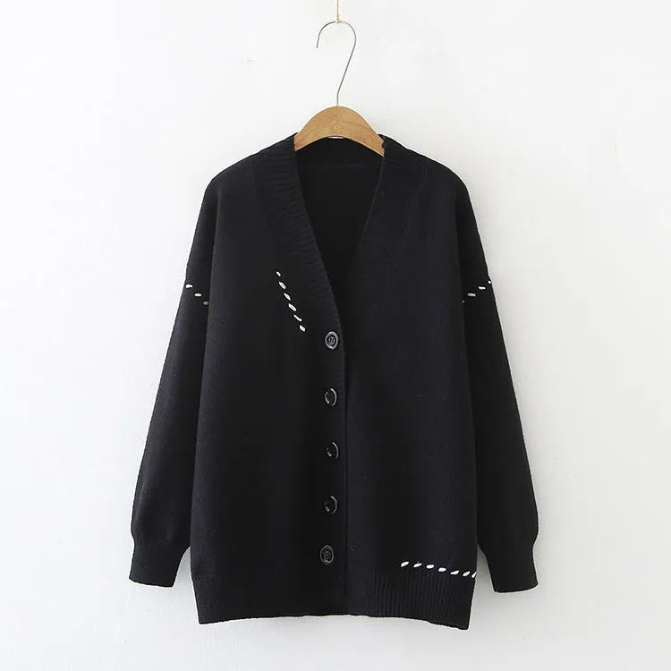Women's knitted cardigan top coat in black or white with loose fit and long sleeves