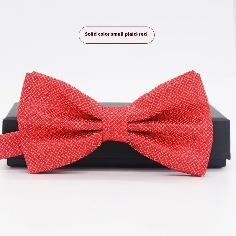 Solid colour flat head bow tie for formal wear in multiple colours including black, red, and blue.