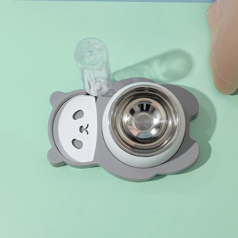 Grey and green tilted elevated pet bowl set with automatic water dispenser bottle for cats and small dogs.