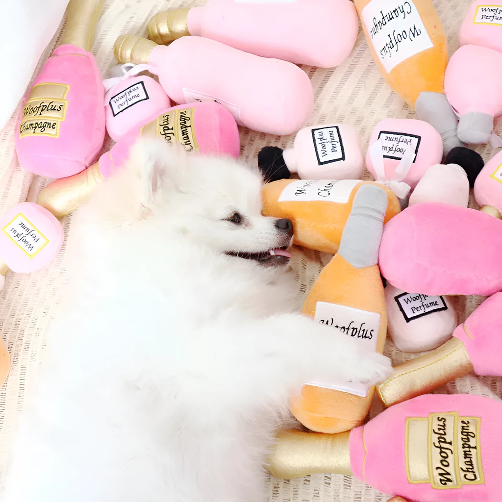 Plush wine bottle pet toy in assorted colours including green, orange, red, black and white.
